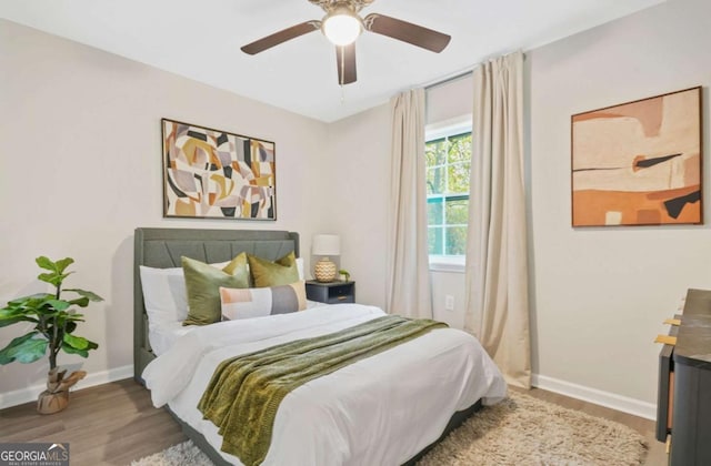 bedroom featuring wood-type flooring and ceiling fan