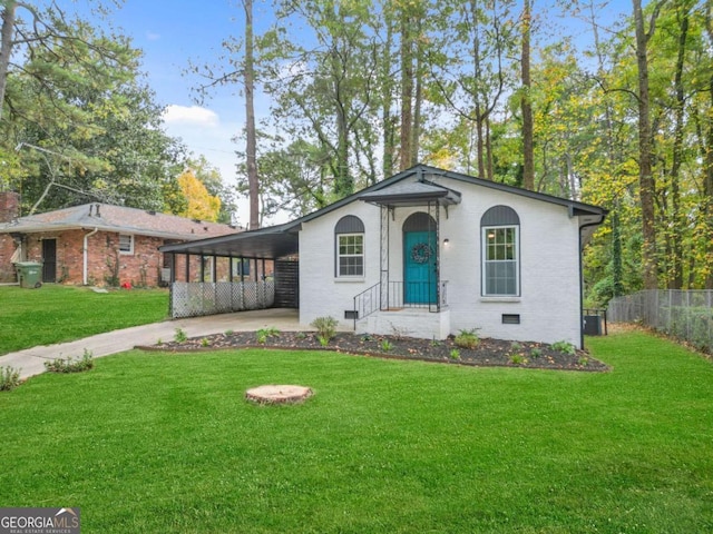 ranch-style home with a front lawn and a carport