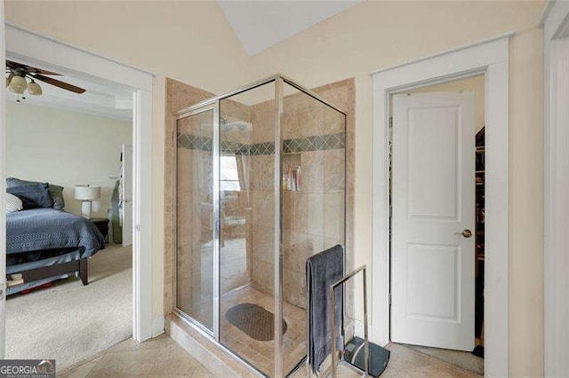 bathroom with ceiling fan and a shower with shower door