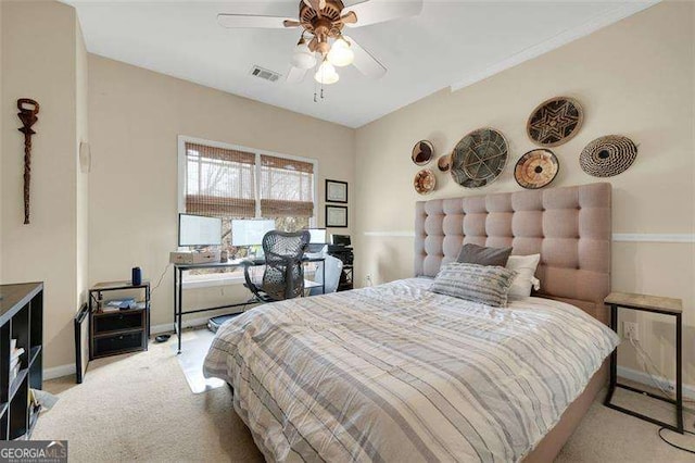 bedroom with ceiling fan and light colored carpet