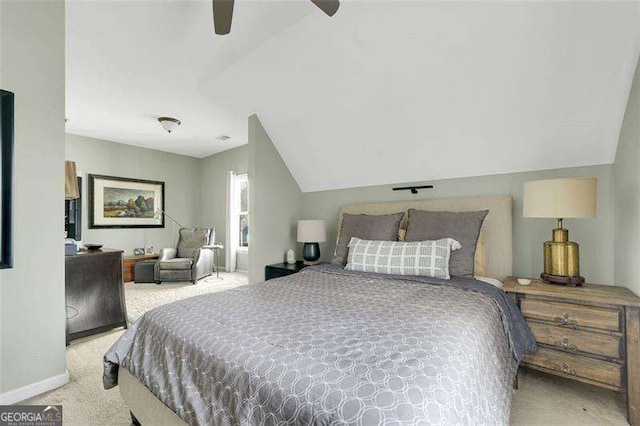 carpeted bedroom featuring ceiling fan and vaulted ceiling