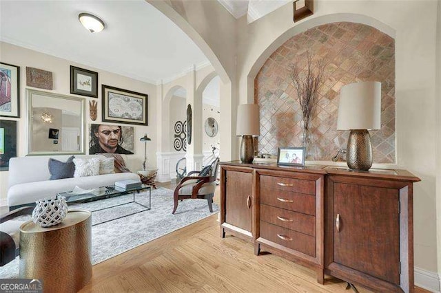 interior space with crown molding and light hardwood / wood-style floors