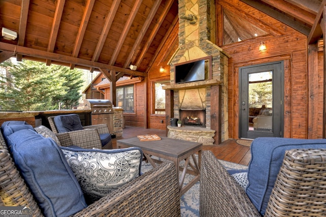 view of patio / terrace with a grill and a fireplace