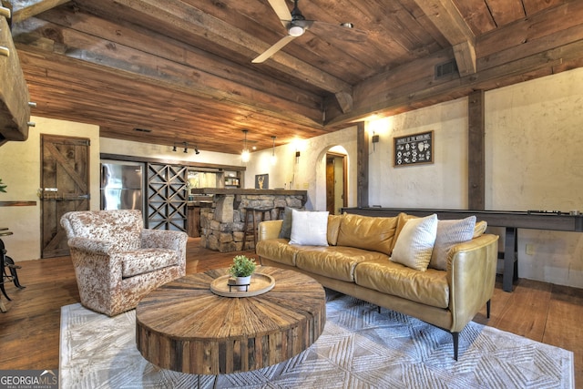 living room featuring wood ceiling, ceiling fan, and hardwood / wood-style flooring