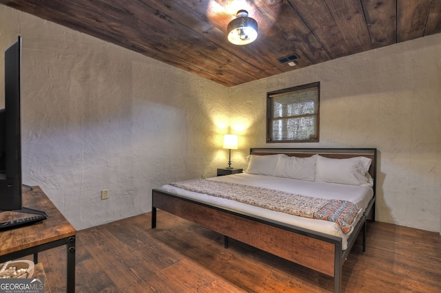 bedroom with wood ceiling and hardwood / wood-style floors