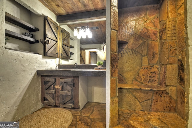 bathroom with vanity, wood ceiling, and beamed ceiling