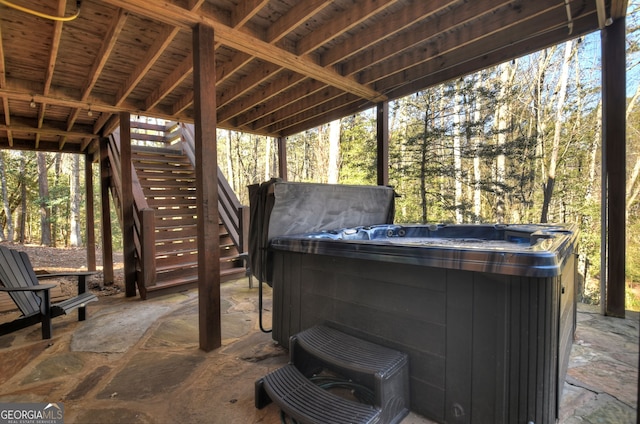 view of patio / terrace with a hot tub