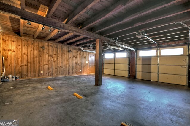 garage featuring wooden walls