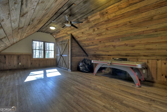 bonus room featuring wood-type flooring, vaulted ceiling, wooden ceiling, and wood walls