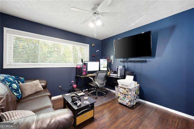 office with dark wood-type flooring, a textured ceiling, and ceiling fan