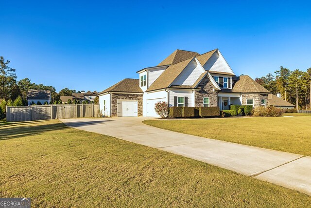 view of front facade with a garage and a front lawn