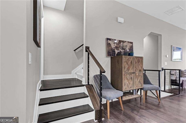 stairway featuring hardwood / wood-style floors