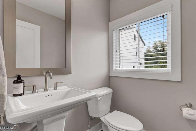 bathroom featuring sink and toilet