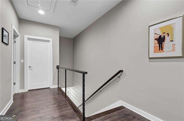 staircase featuring wood-type flooring