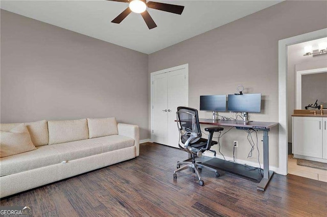 office space with dark wood-type flooring and ceiling fan