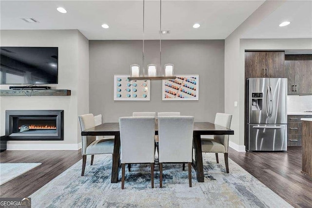 dining area with hardwood / wood-style flooring