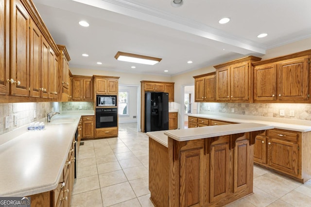 kitchen with sink, crown molding, light tile patterned floors, a center island, and black appliances