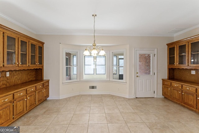 unfurnished dining area featuring an inviting chandelier, light tile patterned floors, and ornamental molding