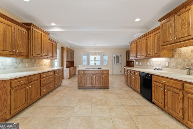 kitchen with tasteful backsplash, hanging light fixtures, black appliances, and sink