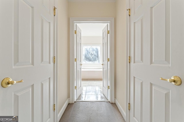 corridor featuring light carpet