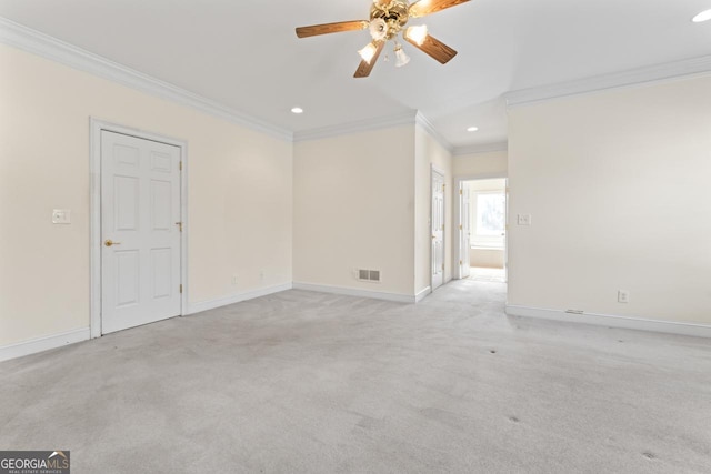 carpeted empty room featuring ceiling fan and ornamental molding