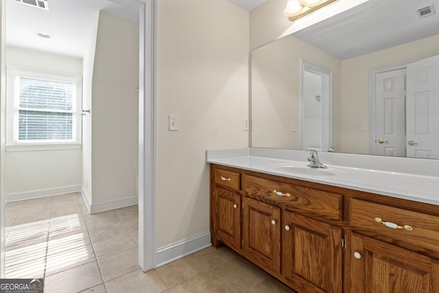 bathroom with vanity and tile patterned floors