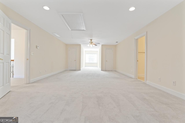 unfurnished room featuring light colored carpet