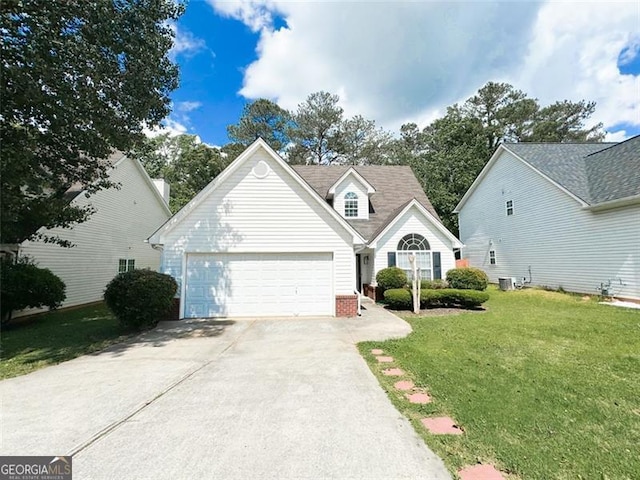 view of front of house with a garage, a front yard, and central air condition unit