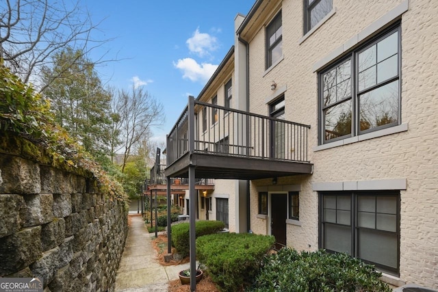 view of side of property featuring a balcony