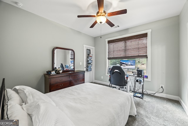 carpeted bedroom with ceiling fan