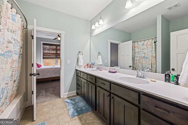 bathroom featuring tile patterned flooring, vanity, shower / bathtub combination with curtain, and ceiling fan