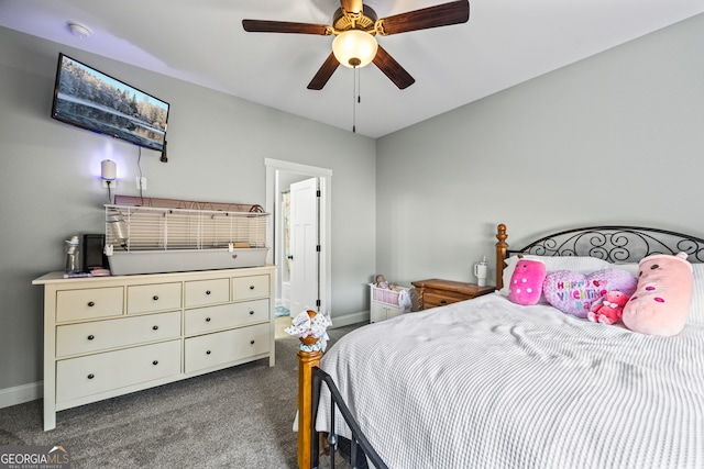 carpeted bedroom featuring ceiling fan and ensuite bathroom