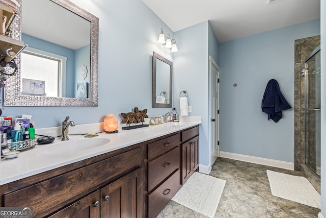 bathroom featuring vanity and an enclosed shower