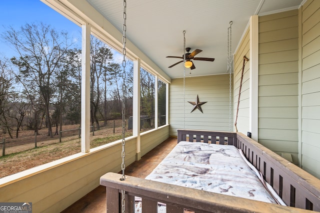 sunroom with ceiling fan