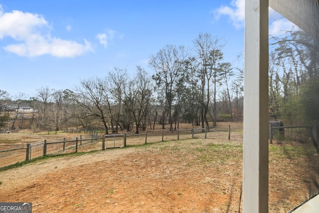 view of yard with a rural view