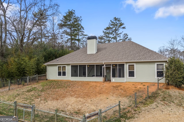 rear view of house with a sunroom