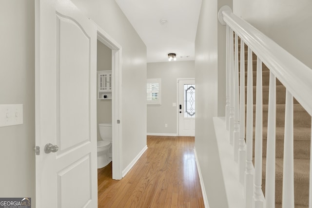 hallway with light wood-type flooring