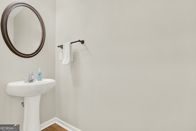 bathroom featuring wood-type flooring