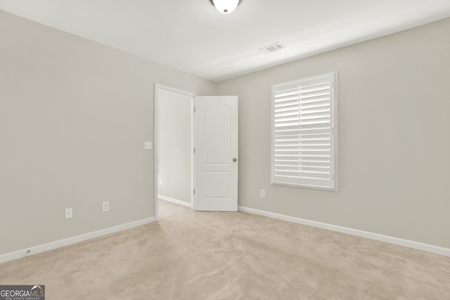 view of carpeted spare room