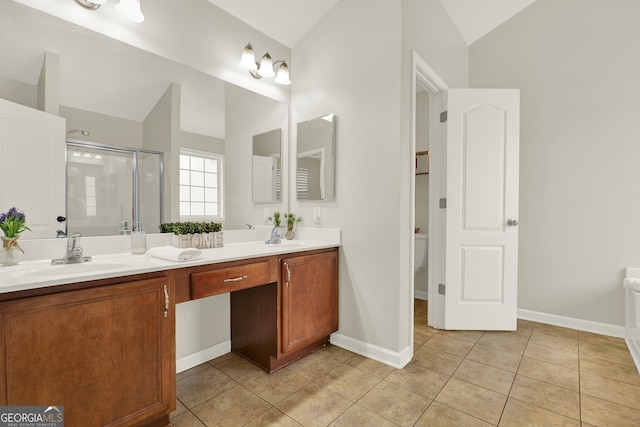 bathroom with vaulted ceiling, tile patterned flooring, vanity, toilet, and a shower with door