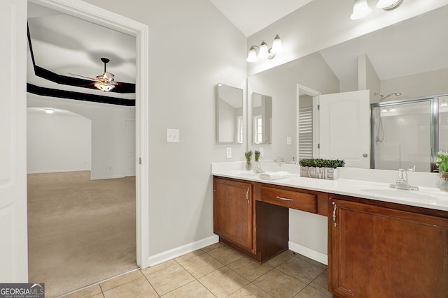 bathroom featuring tile patterned floors, vaulted ceiling, a shower with shower door, and ceiling fan