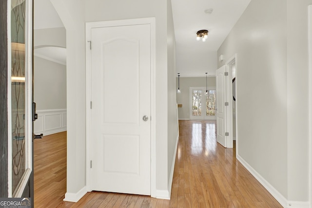 hallway with light hardwood / wood-style flooring