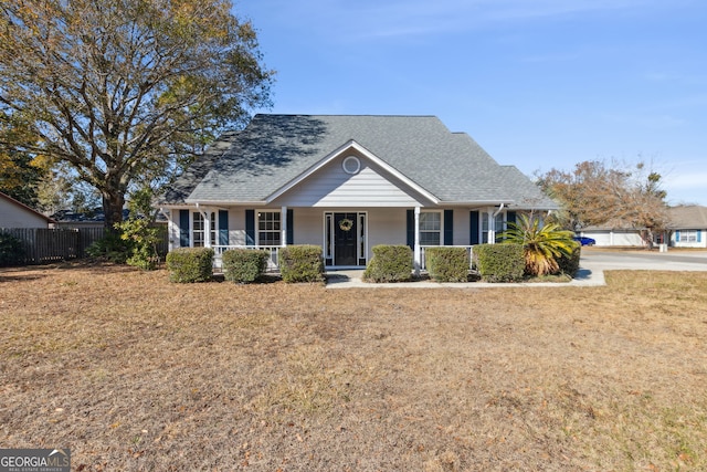 view of front of house featuring a front lawn and a porch