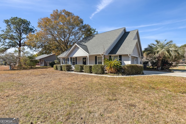 view of front of property featuring a garage and a front yard