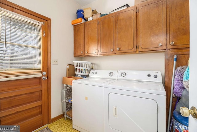 laundry room with cabinets and separate washer and dryer