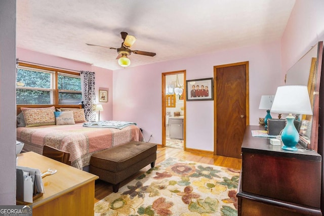 bedroom featuring ceiling fan, connected bathroom, and light wood-type flooring