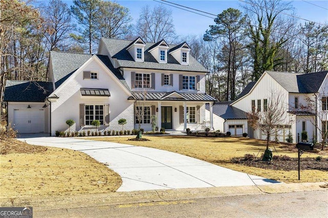 view of front of property with a garage and a front yard