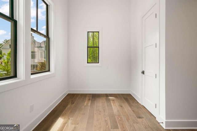 unfurnished room featuring light wood-type flooring