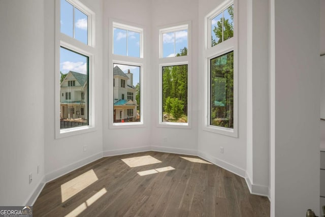 unfurnished sunroom featuring a wealth of natural light