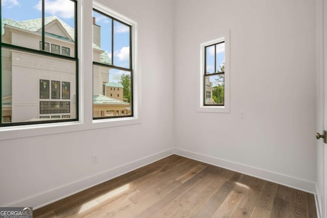 spare room featuring hardwood / wood-style flooring